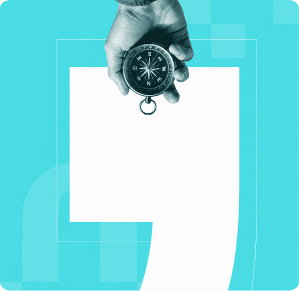 Hand holding a compass, pointing the way